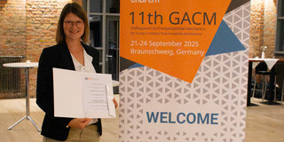The picture shows Dr. Isabelle Noll at the GACM award ceremony for the Best PhD Award.