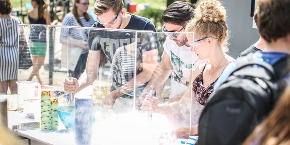 Students wearing goggles at the dry ice stand